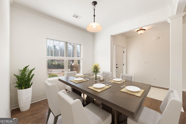 dining space featuring crown molding, visible vents, baseboards, and dark wood-style flooring