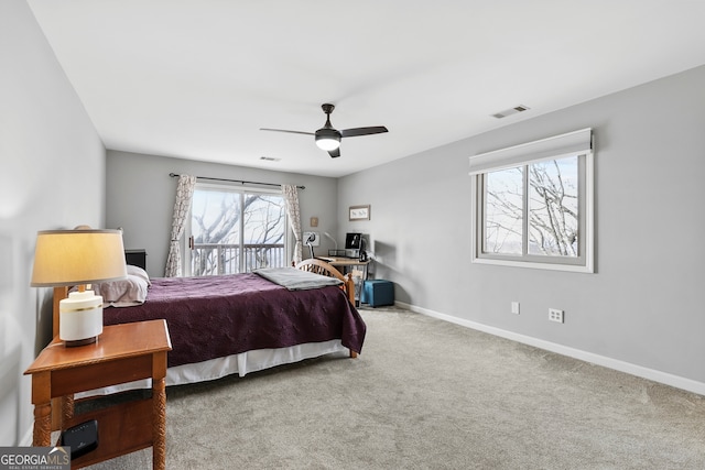 bedroom with carpet flooring, ceiling fan, visible vents, and baseboards