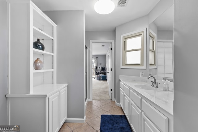 full bath with baseboards, vanity, visible vents, and tile patterned floors