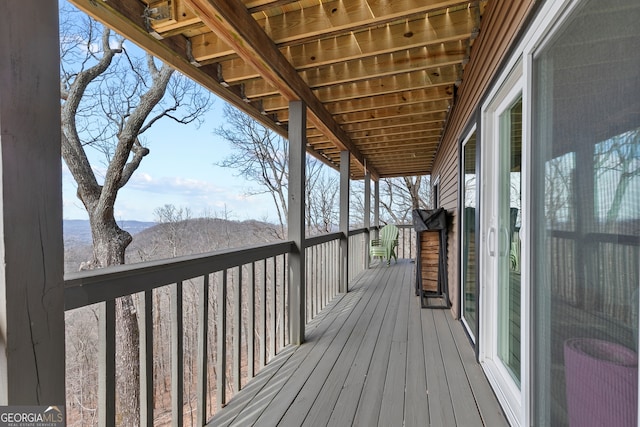 wooden deck featuring a mountain view