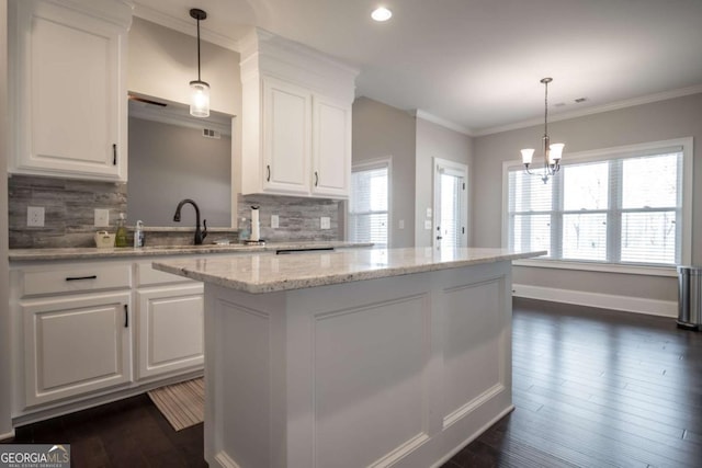 kitchen with pendant lighting and white cabinets