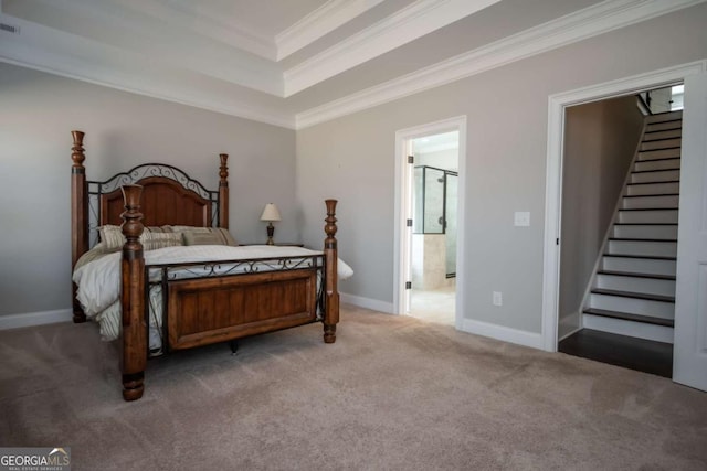 carpeted bedroom with ornamental molding, a raised ceiling, visible vents, and baseboards