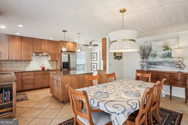 dining area featuring light tile patterned floors, ceiling fan, a textured ceiling, and recessed lighting