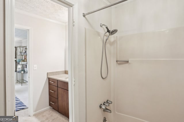 full bathroom with shower / tub combination, crown molding, a textured ceiling, and vanity