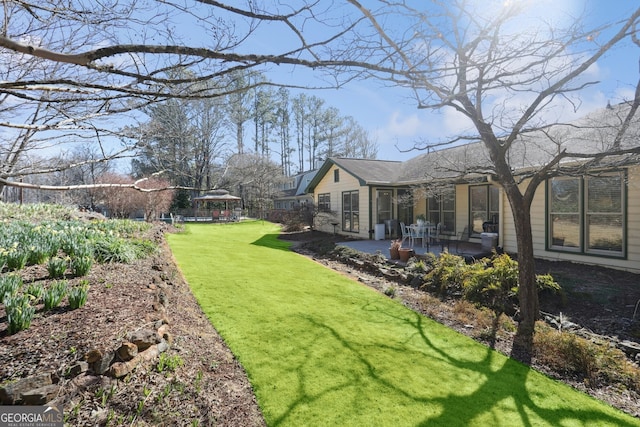 view of yard featuring a patio