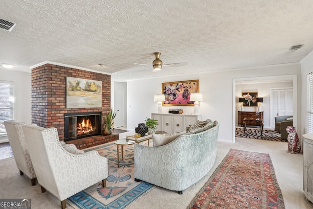 living area with visible vents, a fireplace, light carpet, and a textured ceiling