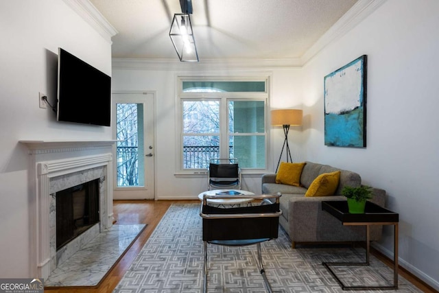 living room featuring ornamental molding, a fireplace, baseboards, and dark wood-style floors