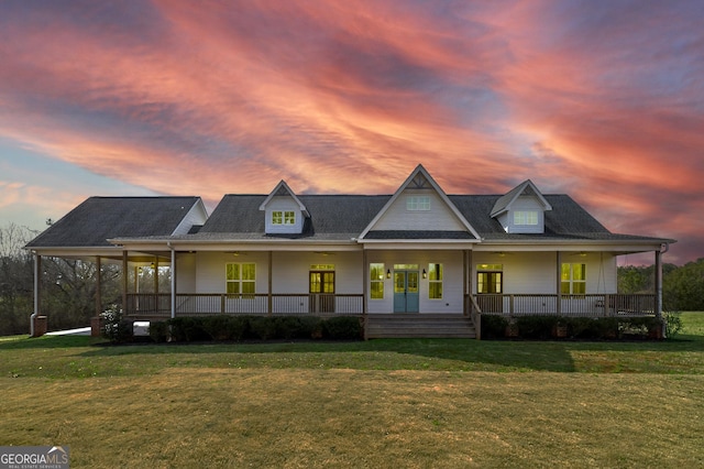 view of front of home featuring a yard and covered porch