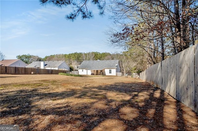 view of yard featuring a fenced backyard