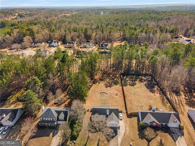 aerial view featuring a forest view