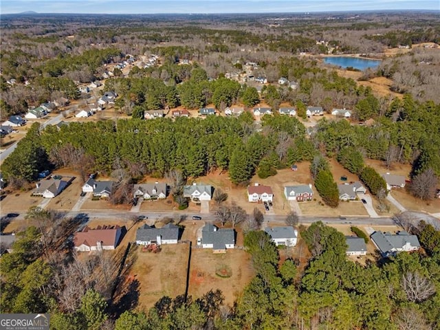 aerial view featuring a water view and a residential view