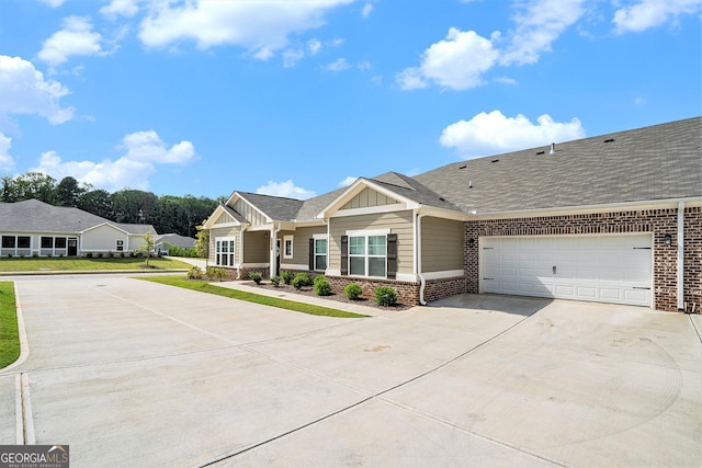 view of front of home featuring board and batten siding, brick siding, driveway, and an attached garage