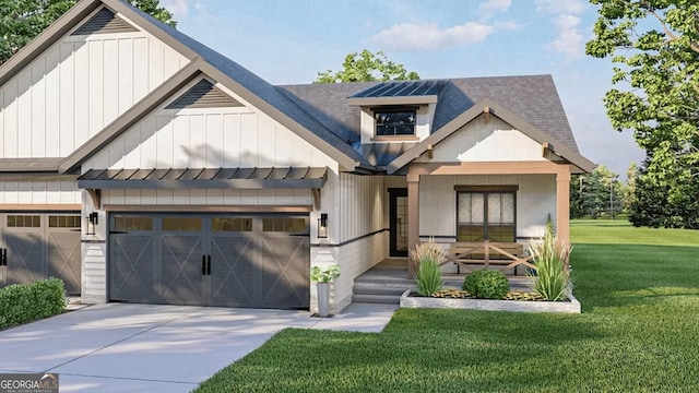 modern farmhouse with an attached garage, driveway, board and batten siding, and a front yard