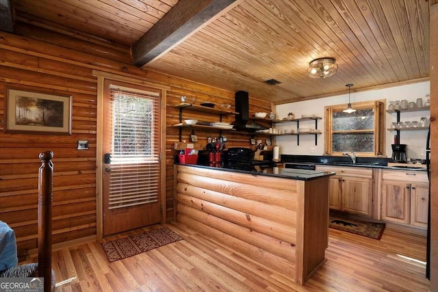 bar with rustic walls, light wood finished floors, wood ceiling, a sink, and exhaust hood