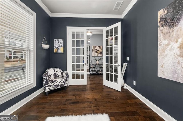 sitting room with baseboards, dark wood-type flooring, and french doors