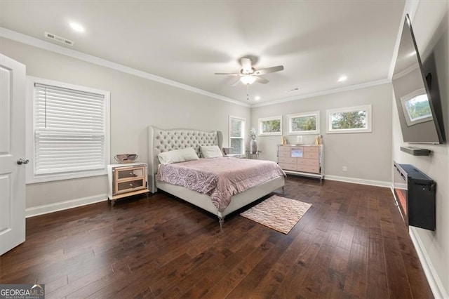 bedroom with visible vents, dark wood-type flooring, ornamental molding, ceiling fan, and baseboards