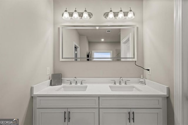 bathroom featuring double vanity and a sink