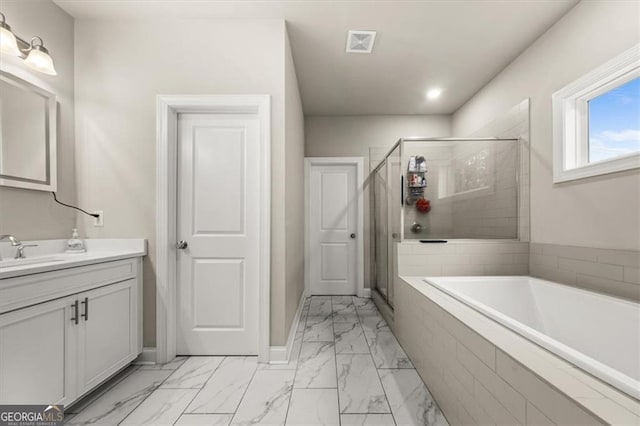 bathroom featuring marble finish floor, a stall shower, vanity, and visible vents