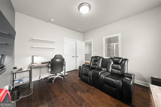 home office with dark wood-style floors and baseboards