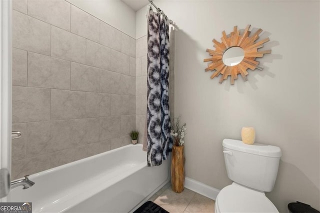 full bathroom with shower / bath combination with curtain, baseboards, toilet, and tile patterned floors