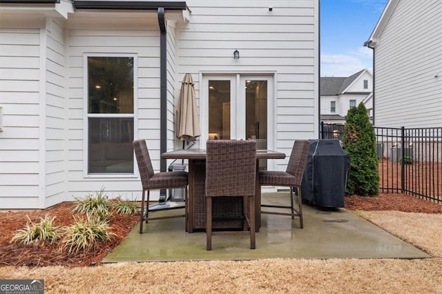 view of patio / terrace featuring outdoor dining area, area for grilling, and fence