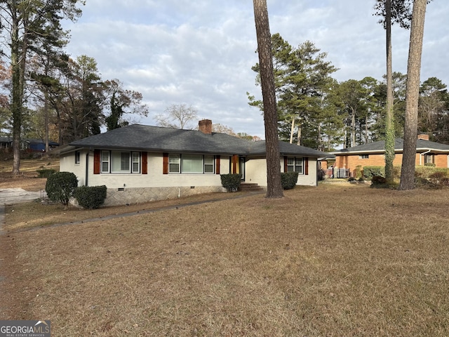 ranch-style house featuring crawl space and a chimney