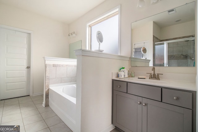 bathroom with visible vents, a stall shower, vanity, tile patterned flooring, and a bath