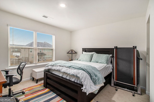 bedroom with light carpet, baseboards, and visible vents