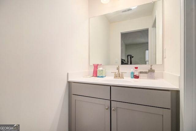 bathroom featuring visible vents and vanity