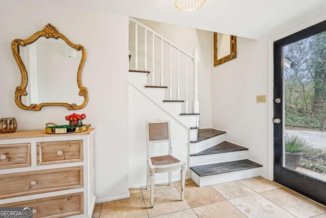 stairway with tile patterned flooring