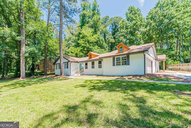 single story home with a front lawn, driveway, and an attached garage