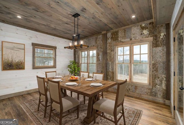 dining area with a notable chandelier, wood ceiling, wood finished floors, and recessed lighting