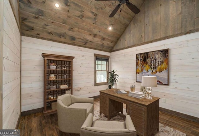 office with wooden walls, a ceiling fan, vaulted ceiling, and dark wood-type flooring