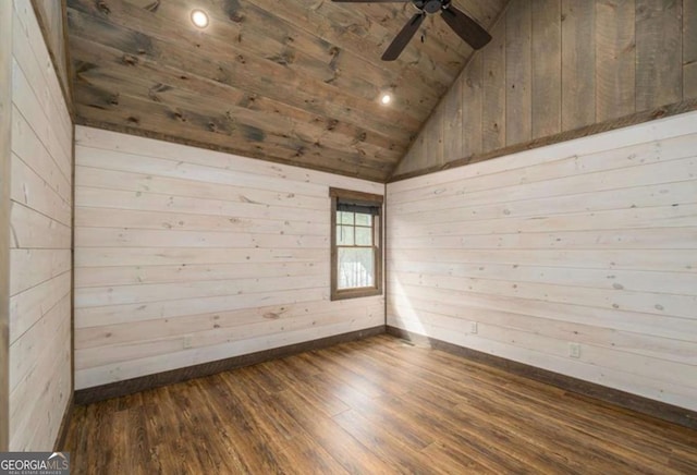 unfurnished room with wood ceiling, ceiling fan, wood finished floors, vaulted ceiling, and wood walls