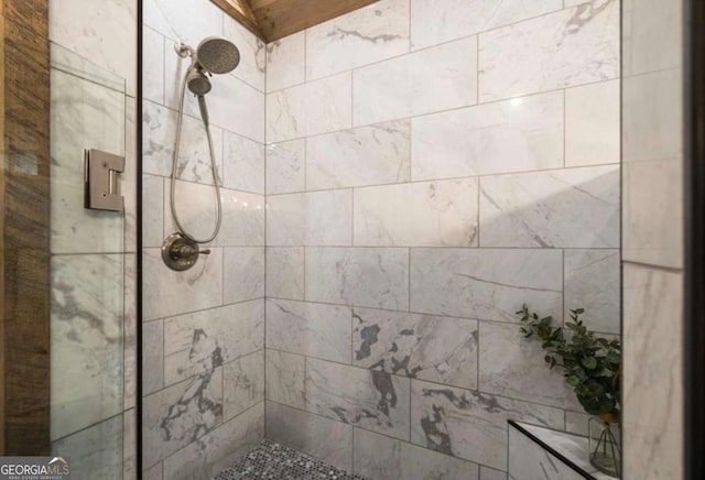 full bathroom with tiled shower