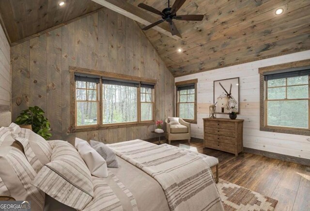 bedroom with dark wood-style floors, multiple windows, wood walls, and high vaulted ceiling