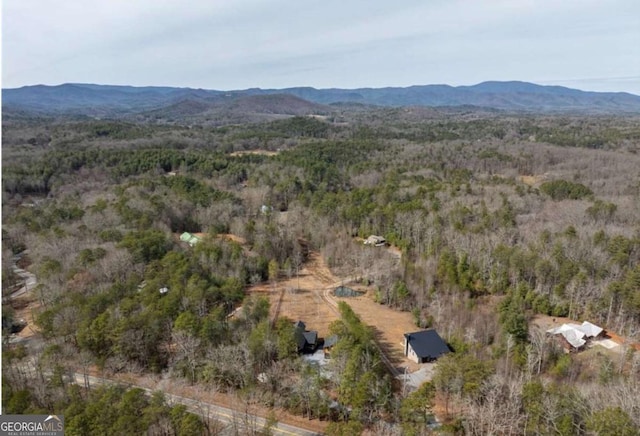 bird's eye view with a forest view and a mountain view