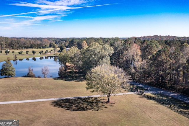 birds eye view of property featuring a water view and a rural view