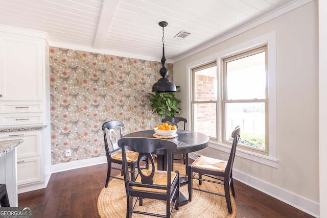 dining room featuring dark wood-style flooring, visible vents, and baseboards