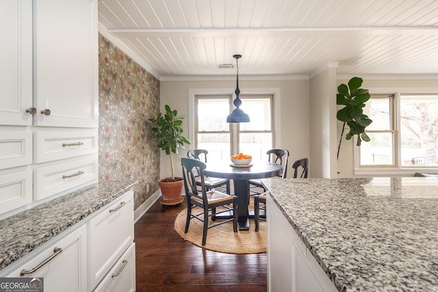 dining area featuring ornamental molding, dark wood-style flooring, wooden ceiling, and visible vents