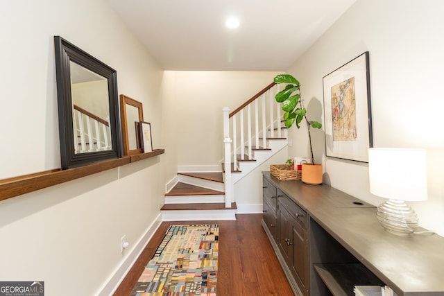 interior space featuring stairway, dark wood-style flooring, recessed lighting, and baseboards