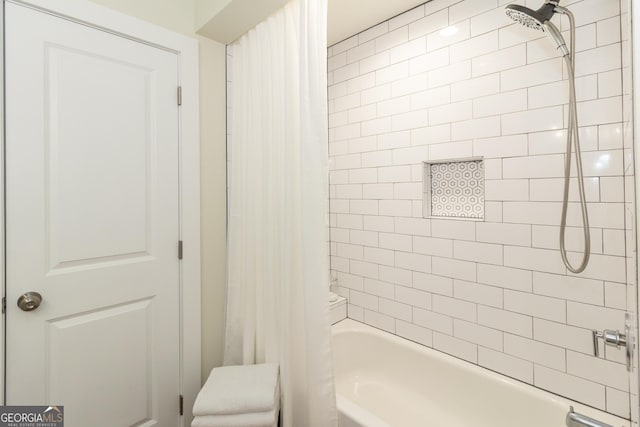 bathroom with shower / tub combo with curtain