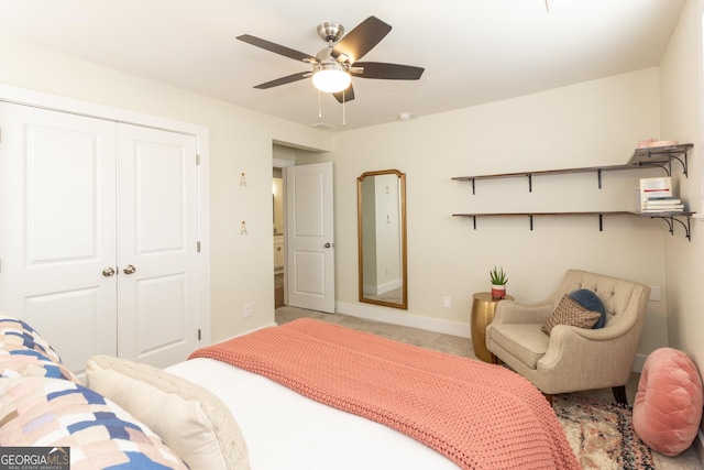 bedroom with carpet, ceiling fan, baseboards, and a closet