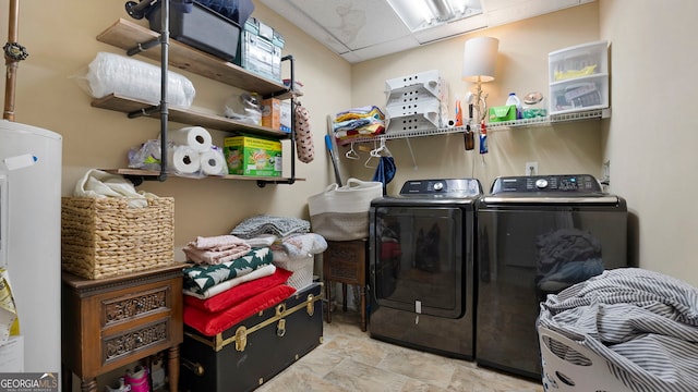 clothes washing area with laundry area and independent washer and dryer