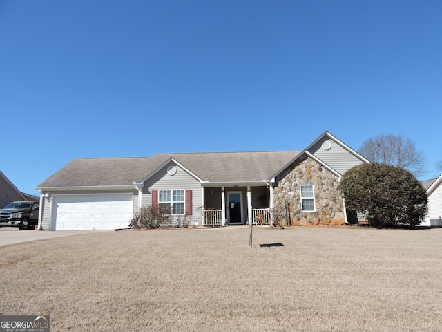 single story home featuring an attached garage, stone siding, driveway, and a porch