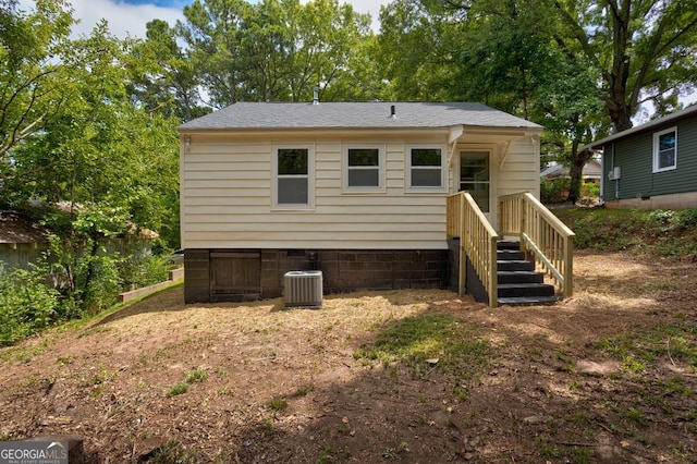 back of property featuring central air condition unit