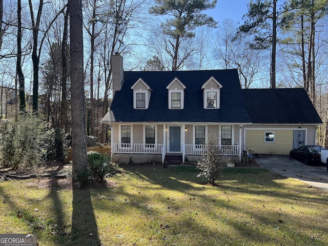 cape cod house with covered porch, a chimney, and a front yard