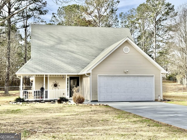 view of front facade featuring concrete driveway, a porch, a front lawn, and an attached garage