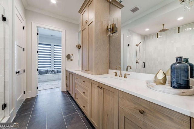 bathroom with double vanity, visible vents, tile patterned flooring, crown molding, and a sink