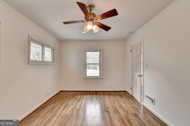 unfurnished room featuring ceiling fan, plenty of natural light, baseboards, and light wood-style flooring